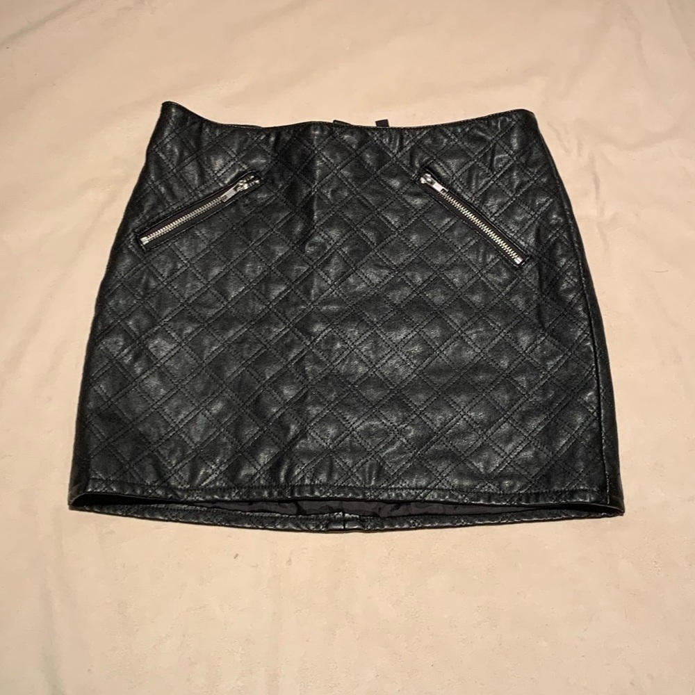 Black quilted leather mini skirt